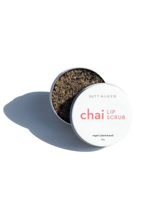 Chai Lip Scrub tin open, showcasing brown scrub inside, promoting waterless skincare and soft, moisturized lips.